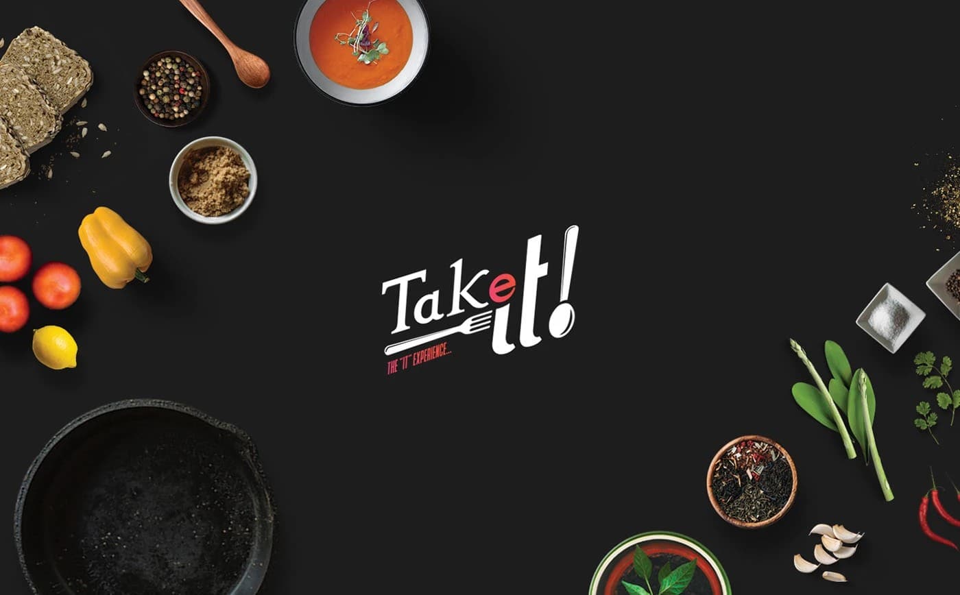 Takeit cloud kitchen brand identity - logo on dark food flatlay